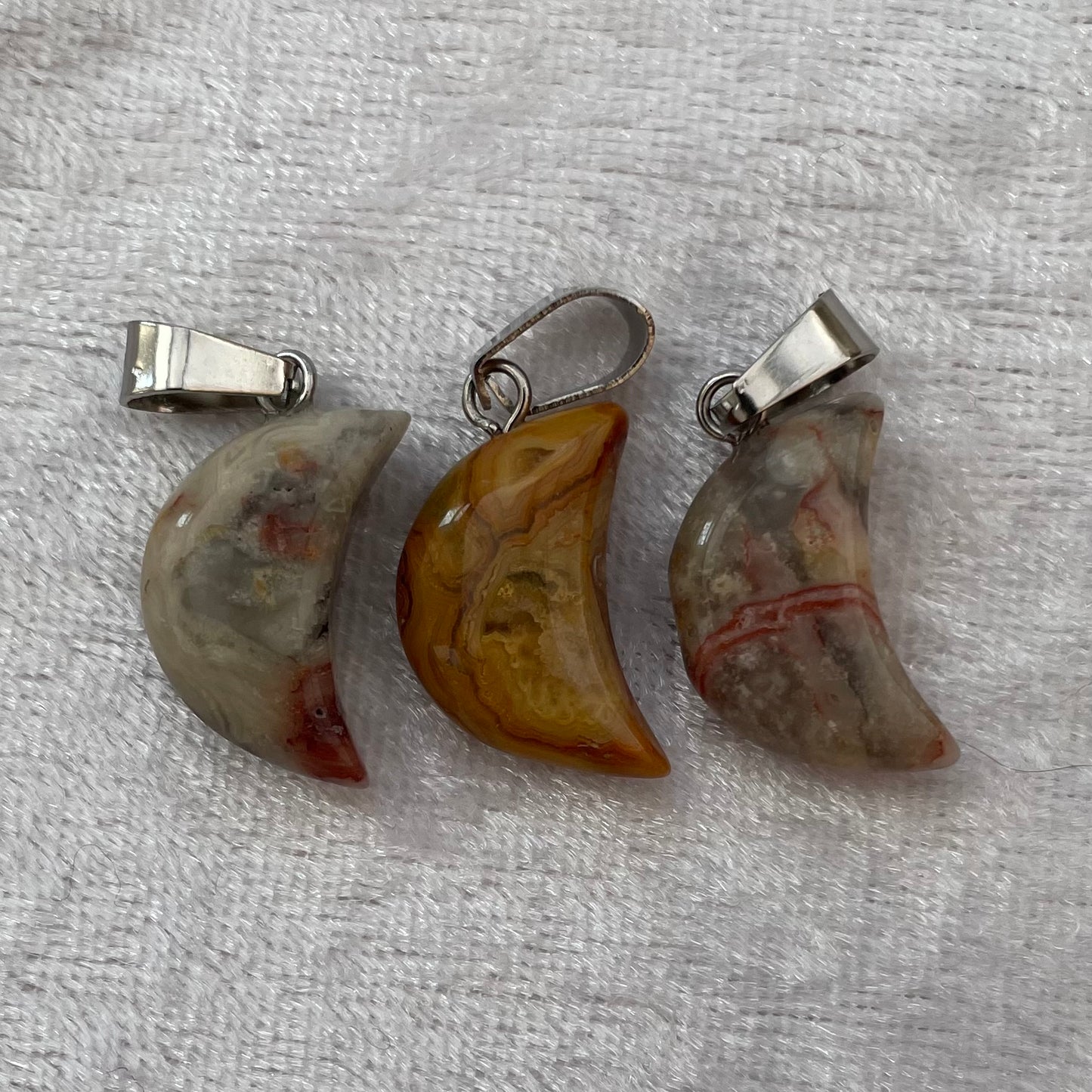 Crazy Lace Agate Moon Pendants